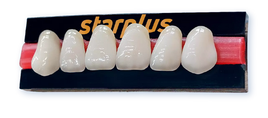 Five realistic white ceramic dental crowns displayed on a black and red Starplus training mold against a white background.